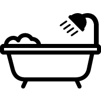 En suite bathroom with bath and power shower